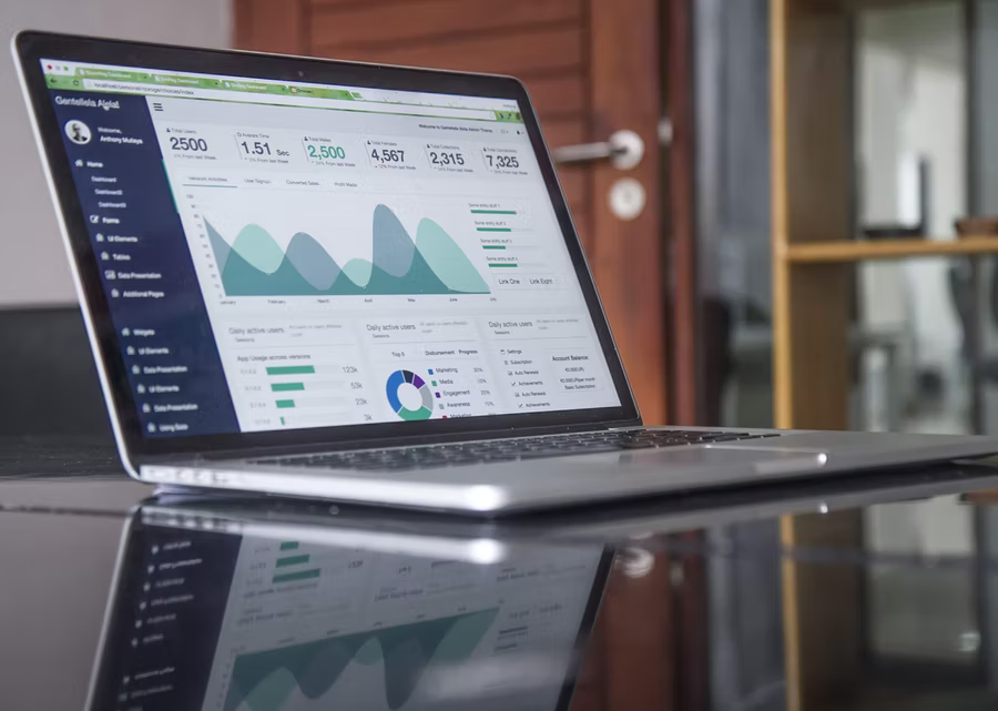 A laptop is open on a tabletop showing the online donation platform for nonprofits dashboard.