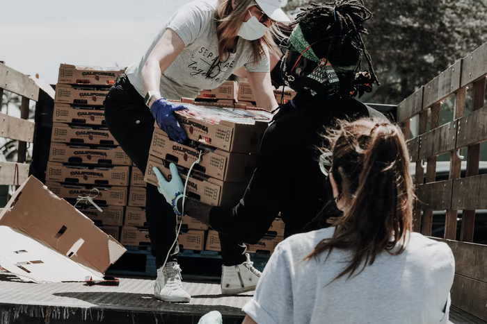 Volunteers work together during the Covid pandemic to help nonprofit organizations.