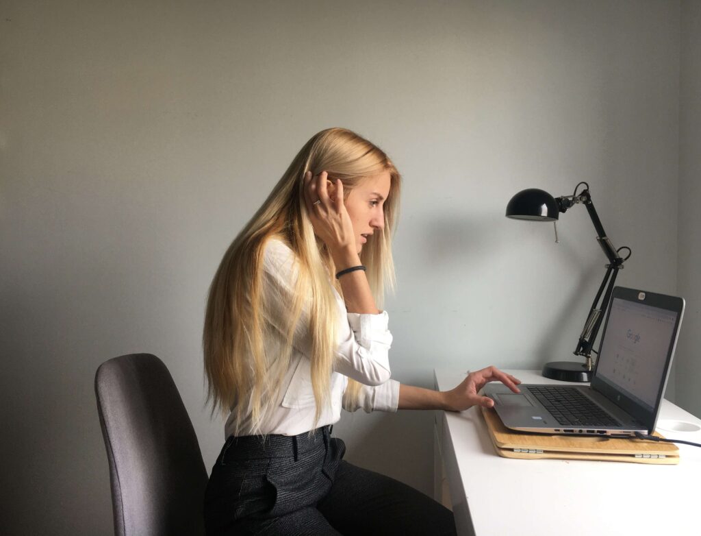 A woman sits at her computer as she works for her nonprofit organization