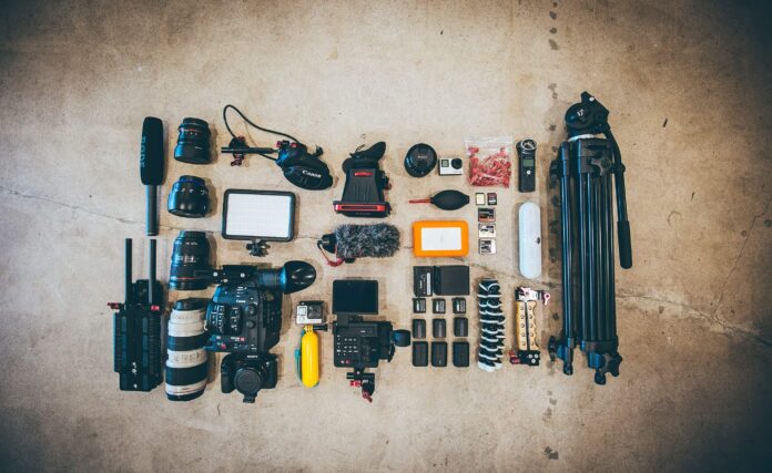 Video marketing tools for nonprofits are laid out for a flat lay photo.
