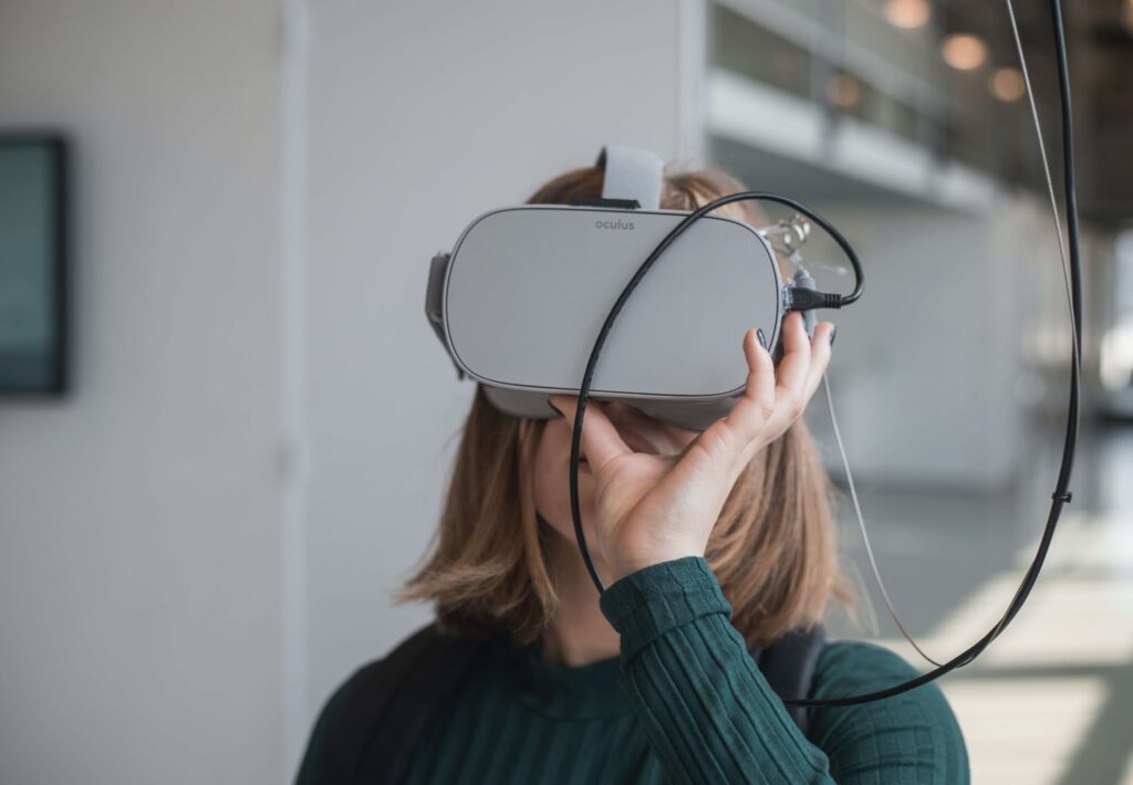 A young woman uses a headset to participate in VR for nonprofits at a fundraising event.