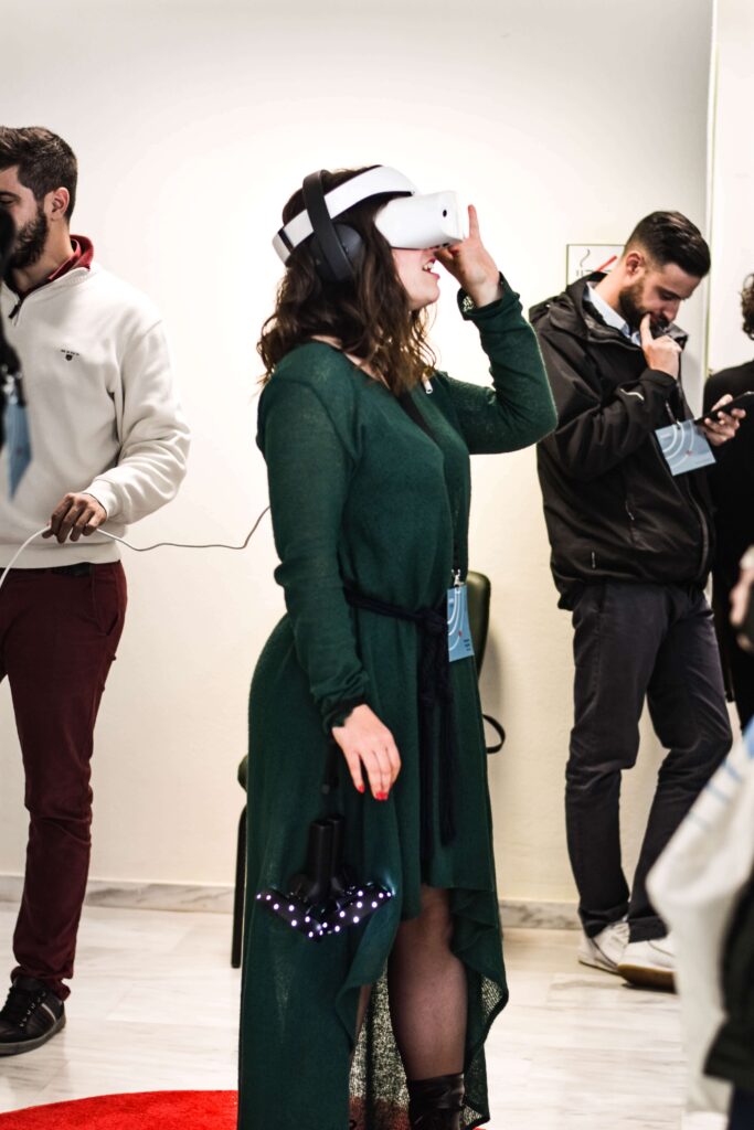 A person wears a VR headset at a nonprofit in-person event. 