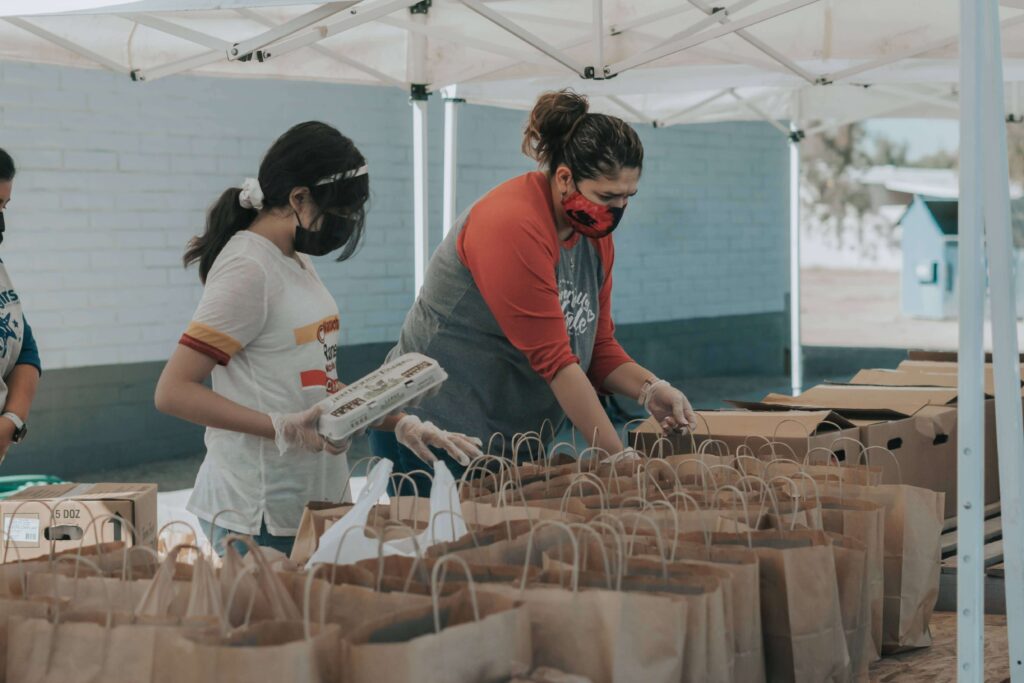 Volunteers work with a nonprofit after signing up through a volunteer management system, like Get Connected.