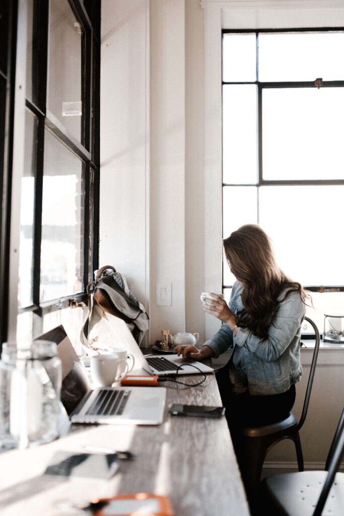 Nonprofit professional works through nonprofit grant writing resources on a computer. 