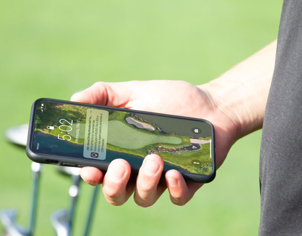 A close-up of a mobile phone screen showing an app notification.
Caption: Tech streamlines participant communication through channels like mobile app notifications or email